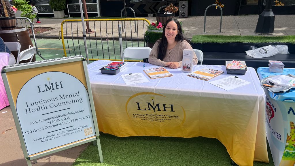 Amaranta Henriquez at her Luminous Mental Health Counseling community outreach table